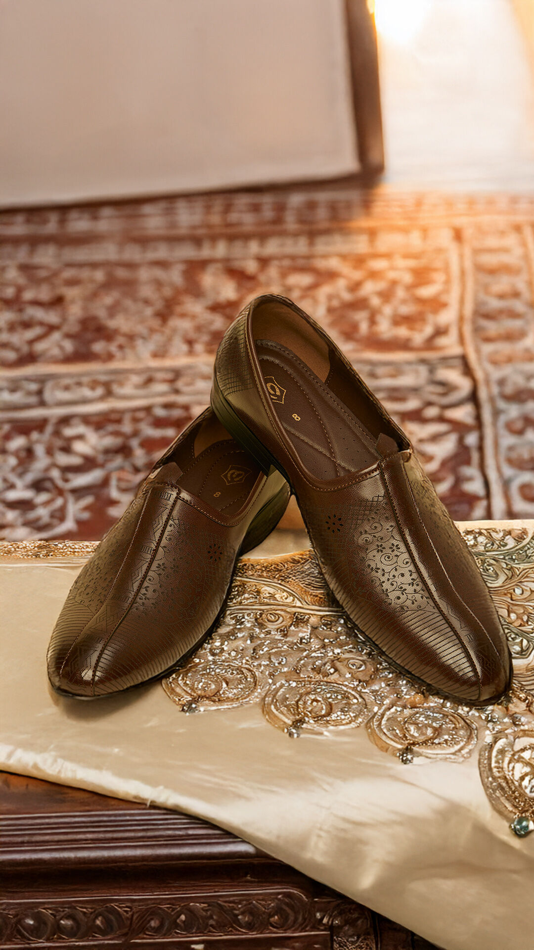 A brown leather jutti with a sleek and elegant design.